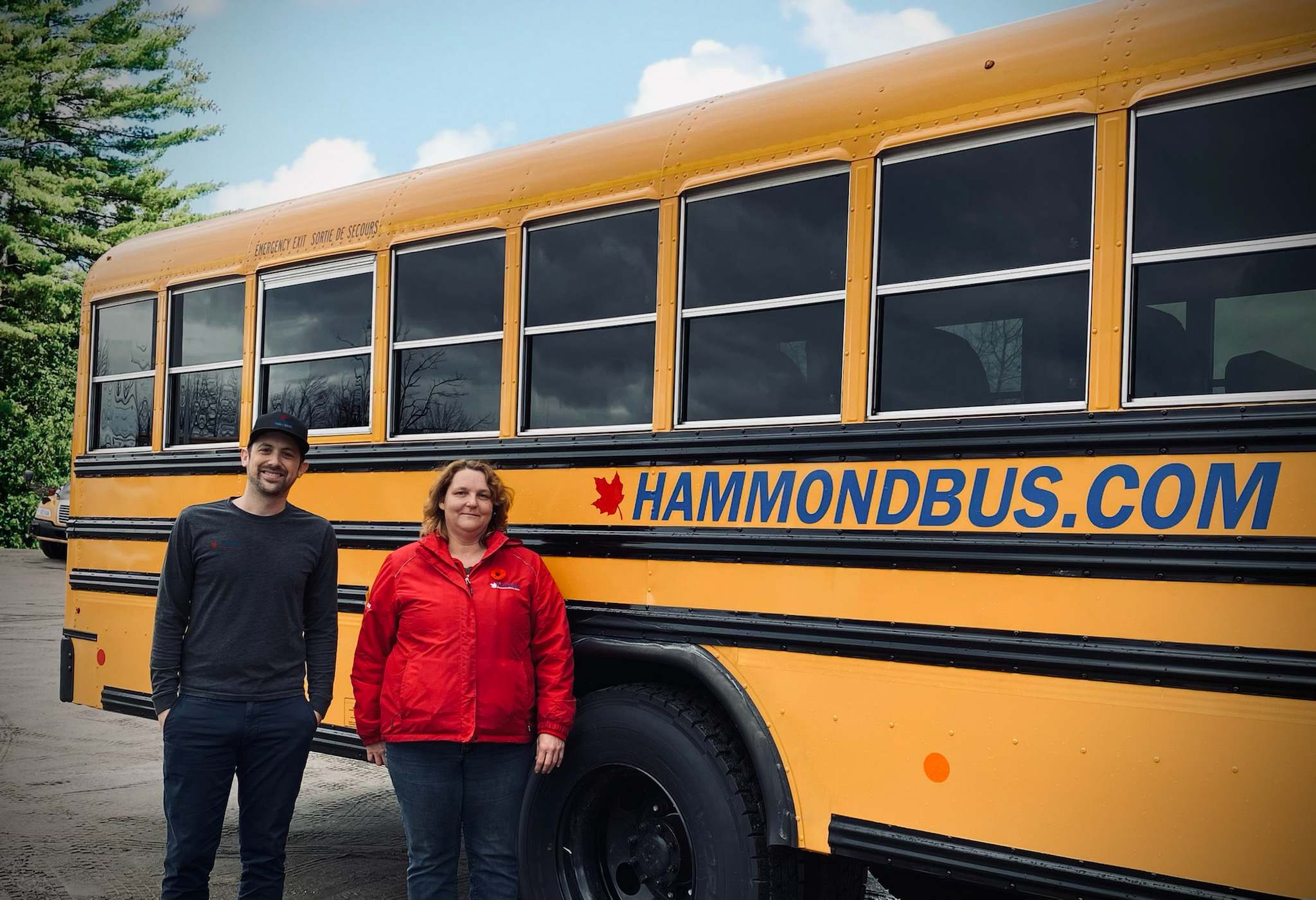 Kent Hammond, Manager, and Sharon Edwards, bus driver, with one of the newly-rebranded buses (Supplied by Greg Hammond, Hammondbus.com)